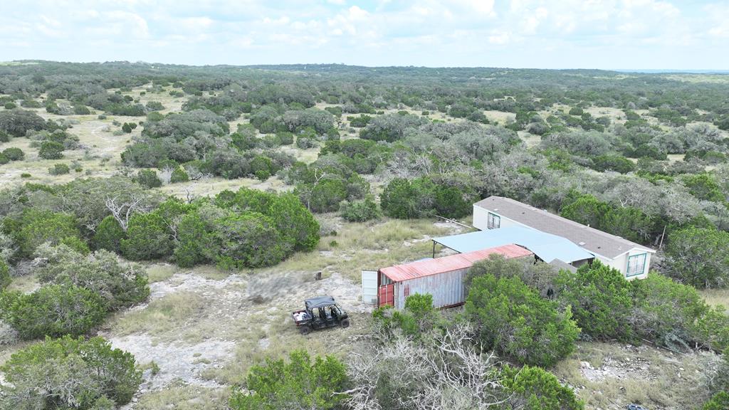 an aerial view of house with yard