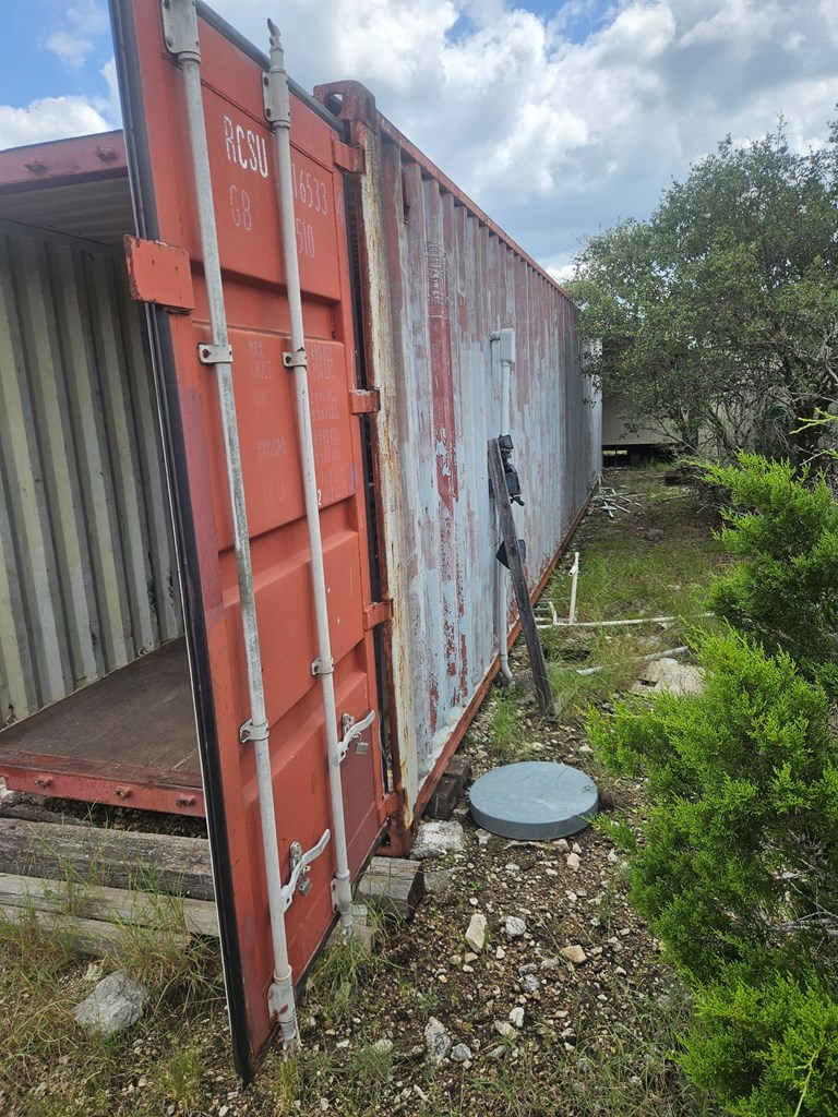 1862 Sd 31846 Rocksprings, TX 78880 - Photo 19 of 32 a backyard of a house with a yard fire pit and deck