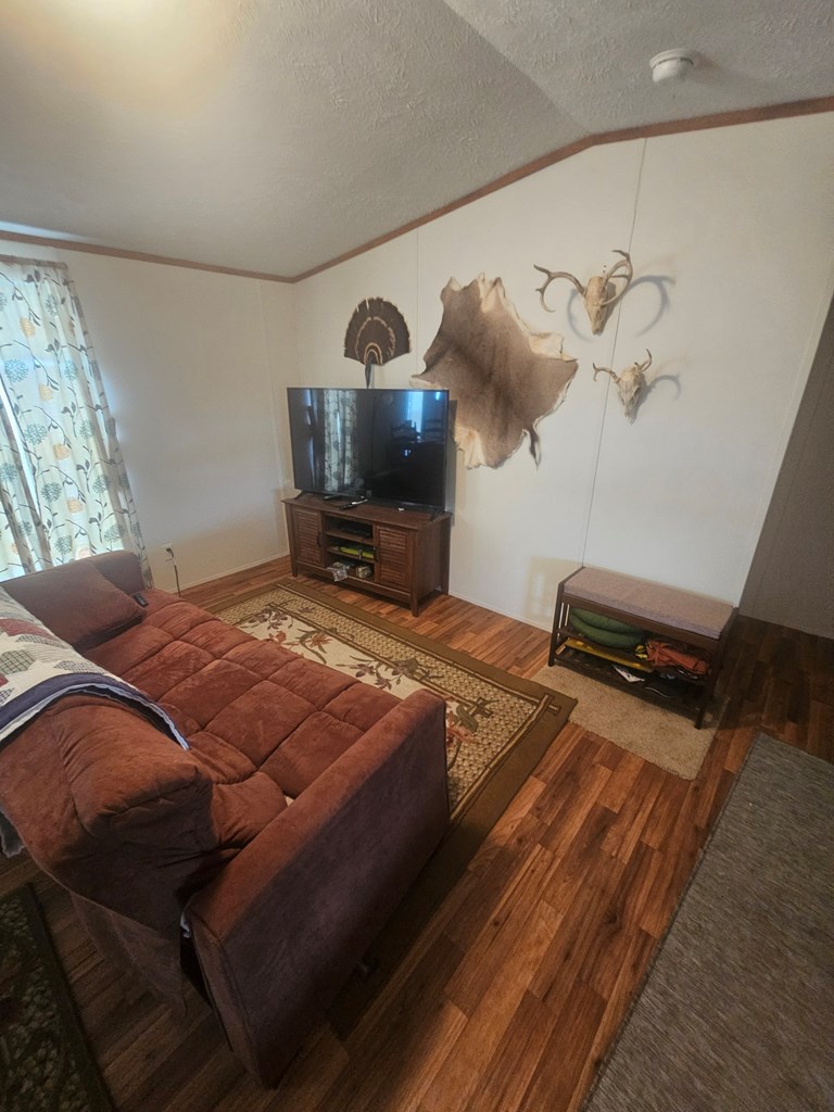 1862 Sd 31846 Rocksprings, TX 78880 - Photo 25 of 32 a bedroom with a bed and a chandelier