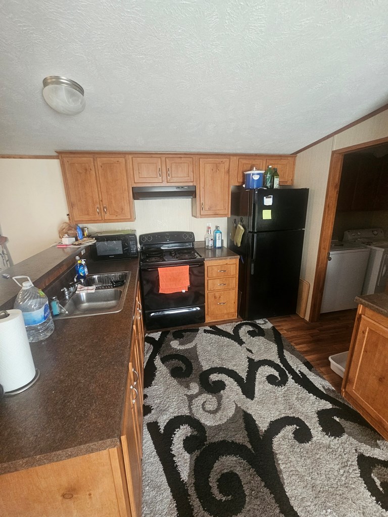 1862 Sd 31846 Rocksprings, TX 78880 - Photo 26 of 32 a kitchen with a sink appliances and cabinets
