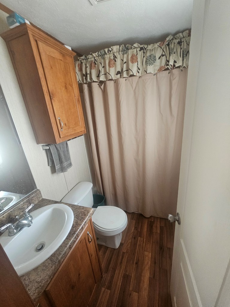 1862 Sd 31846 Rocksprings, TX 78880 - Photo 32 of 32 a bathroom with a sink and a mirror