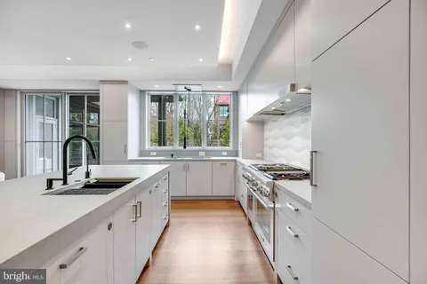 a bathroom with a sink a mirror and a toilet