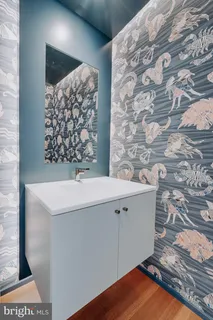 a living room with furniture a fireplace and a window