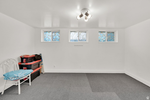 4635 Box Elder Street Murray, UT 84107 - Photo 12 of 21 Sitting room with carpet flooring and baseboards