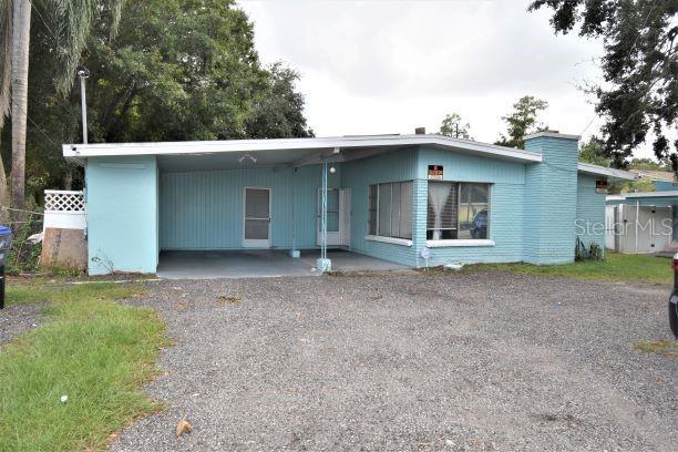 1448 Wakulla Way Orlando, FL 32839 - Photo 1 of 1 a view of a house with a yard and garage