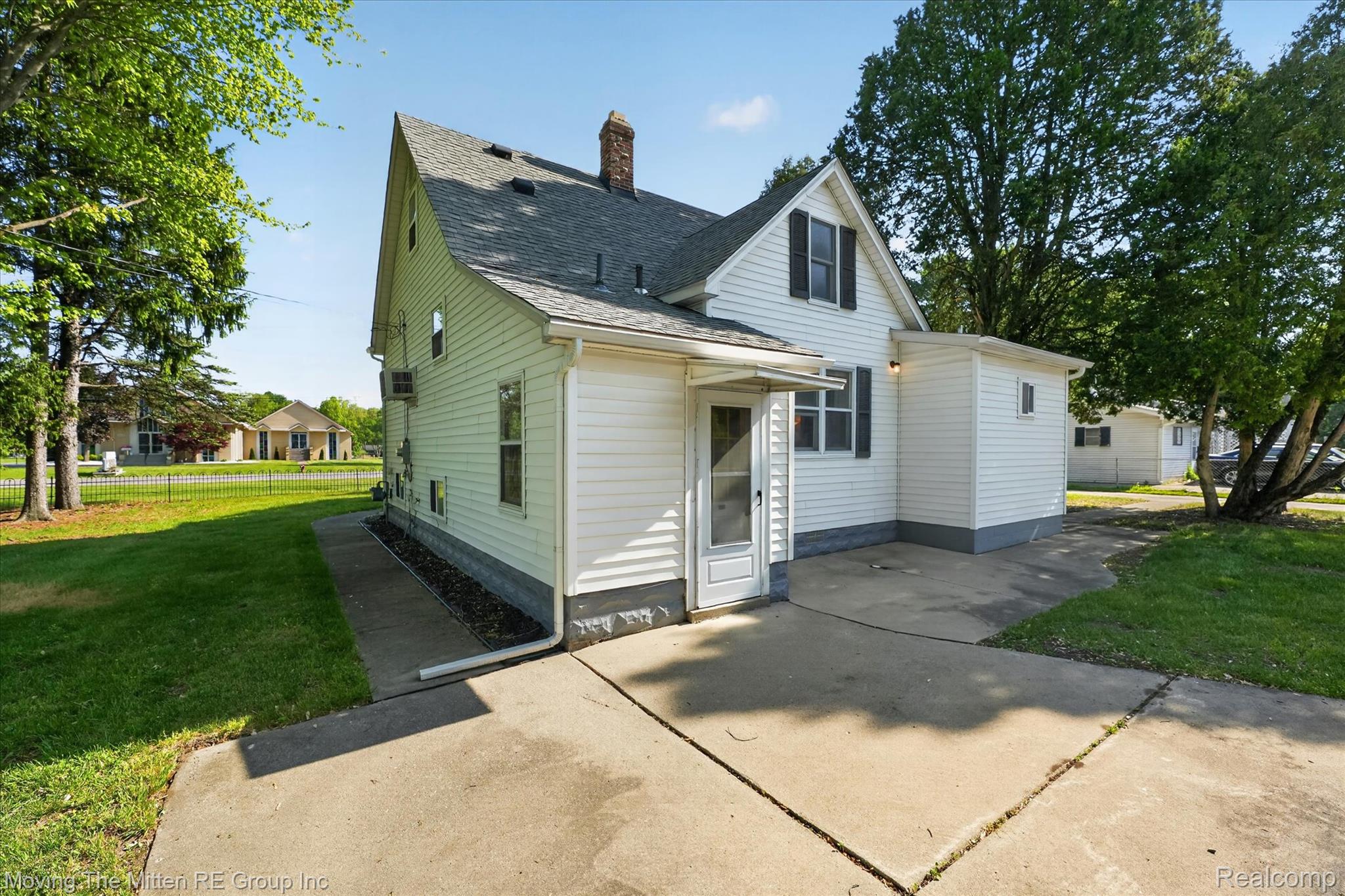 25505 Wick Road Taylor, MI 48180 - Photo 39 of 68 Rear view of property featuring a chimney and a shingled roof