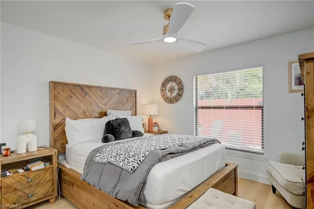 a view of a workspace with furniture and wooden floor