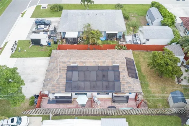 an aerial view of a house with a swimming pool