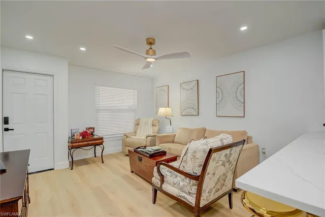a living room with furniture and a lamp