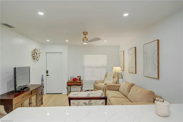 a kitchen with a refrigerator and a sink