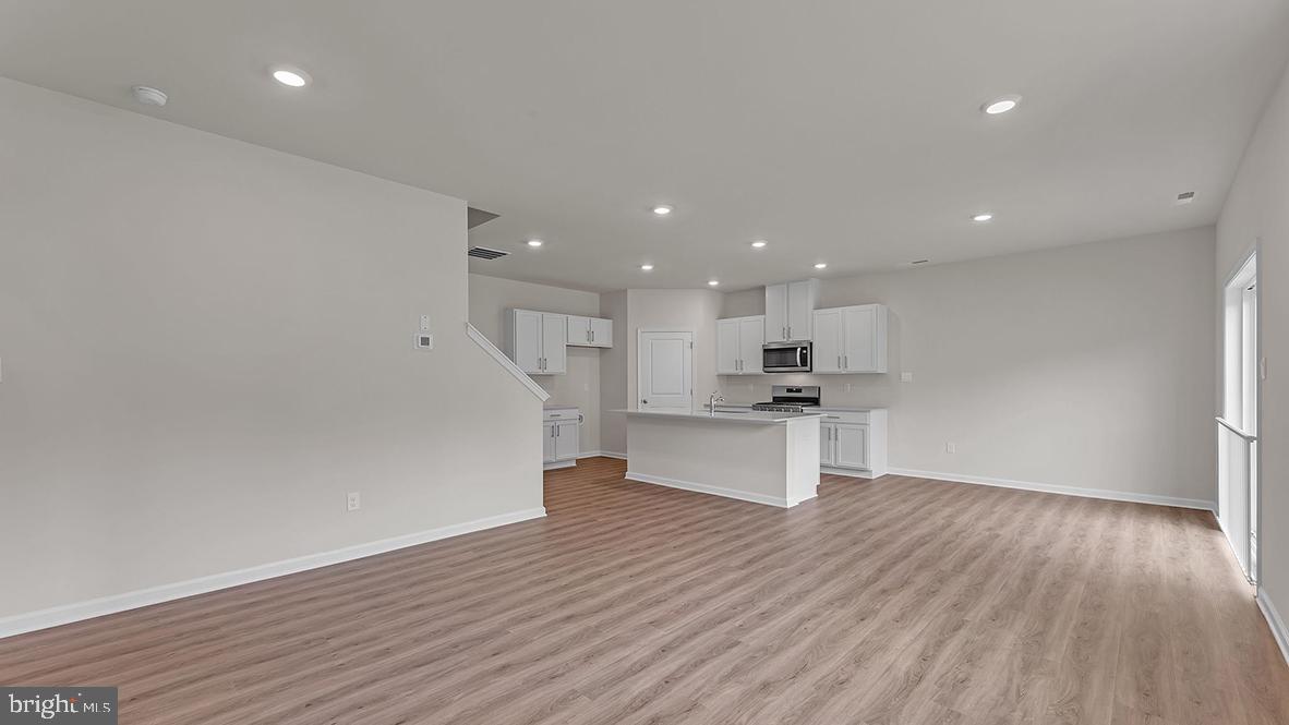 155 Littleworth Road Manahawkin, NJ 08050 - Photo 12 of 32 a view of kitchen with kitchen island wooden floor and center island