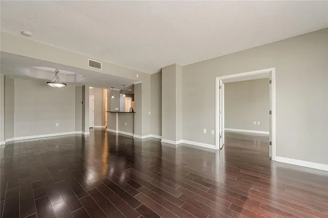 a kitchen with stainless steel appliances a refrigerator sink and microwave