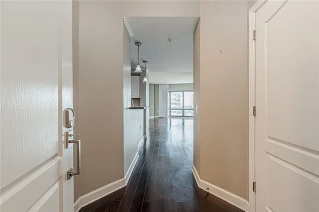 a kitchen with a sink and white cabinets