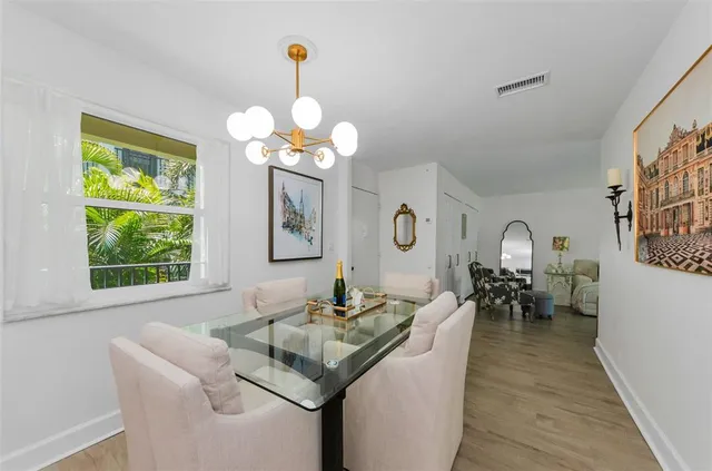 a view of a dining room with furniture window and outside view