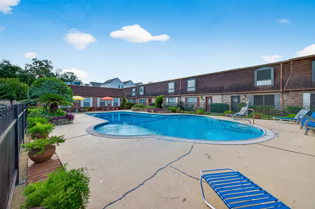 a view of a swimming pool with a patio