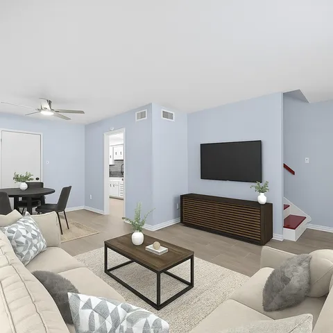 a living room with furniture and a flat screen tv