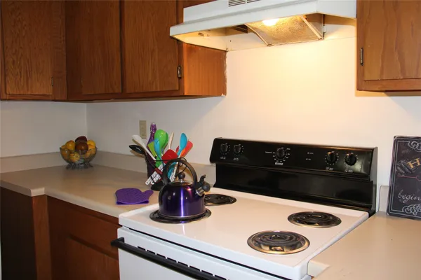 a kitchen with a stove and a microwave