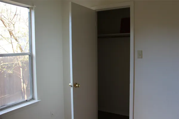 a view of walk in closet with a window