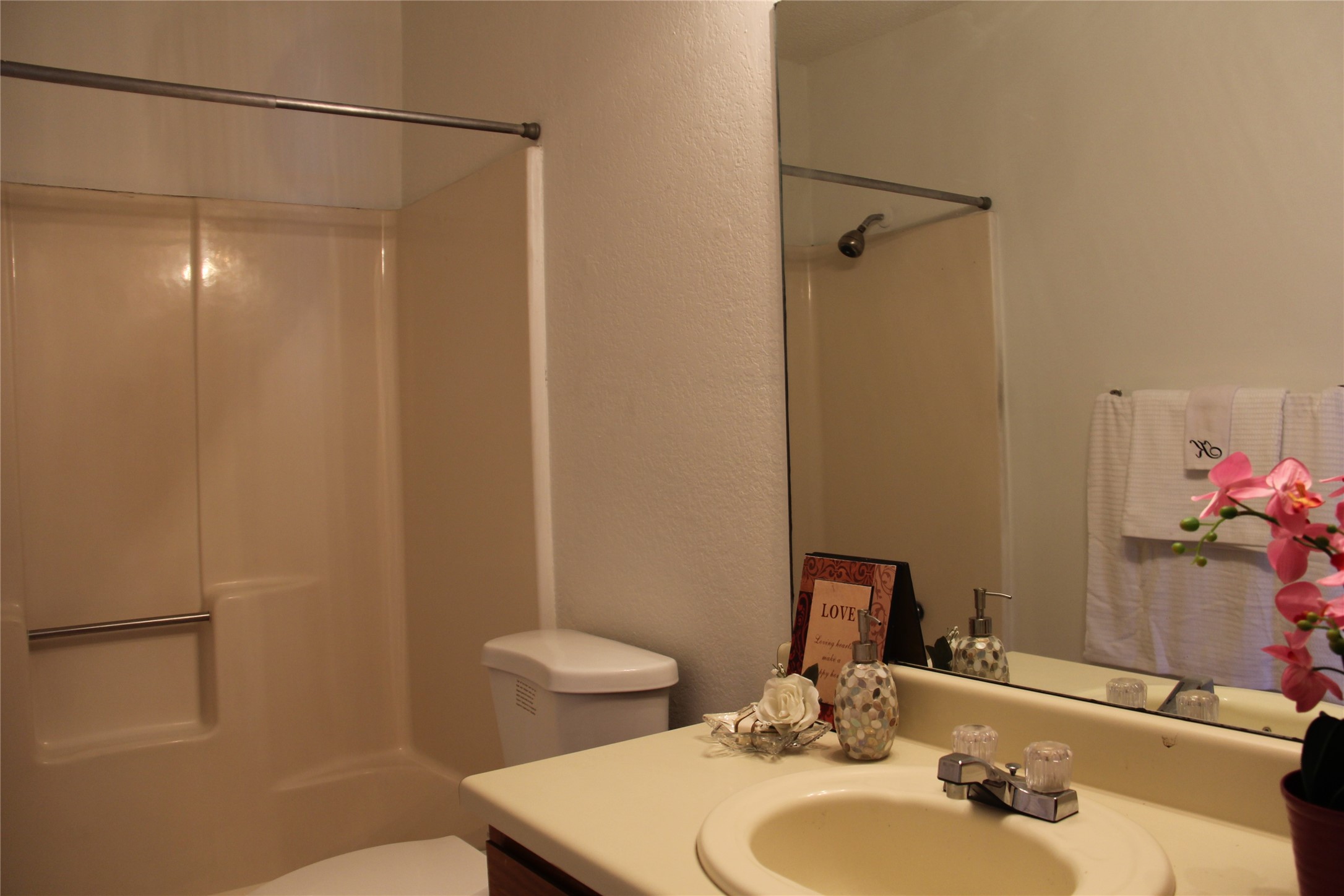 11611 Rustic Rock Drive, Unit B Austin, TX 78750 - Photo 16 of 25 a bathroom with a sink and a mirror