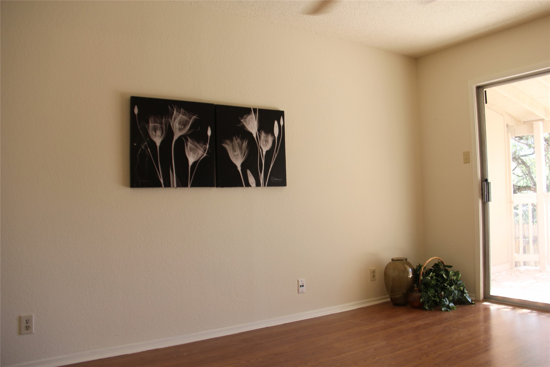 11611 Rustic Rock Drive, Unit B Austin, TX 78750 - Photo 19 of 25 an empty room with wooden floor and a window