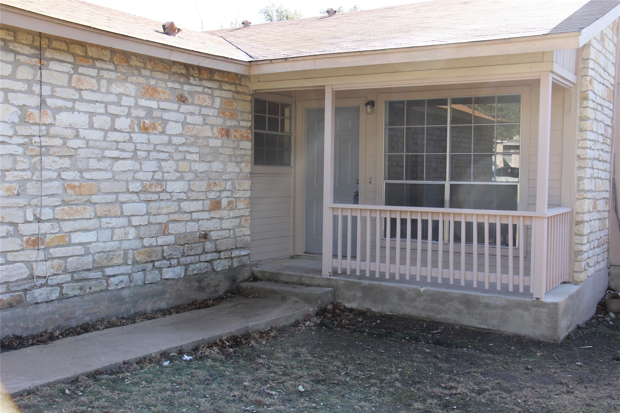 11611 Rustic Rock Drive, Unit B Austin, TX 78750 - Photo 3 of 25 a view of a porch with a bench