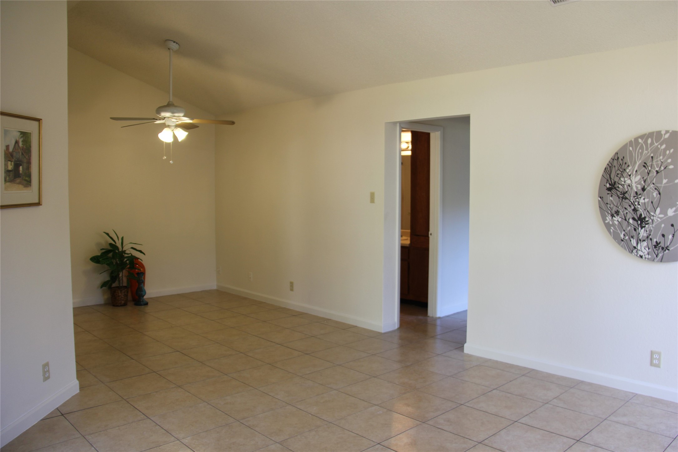 11611 Rustic Rock Drive, Unit B Austin, TX 78750 - Photo 5 of 25 an empty room with closet and a chandelier fan