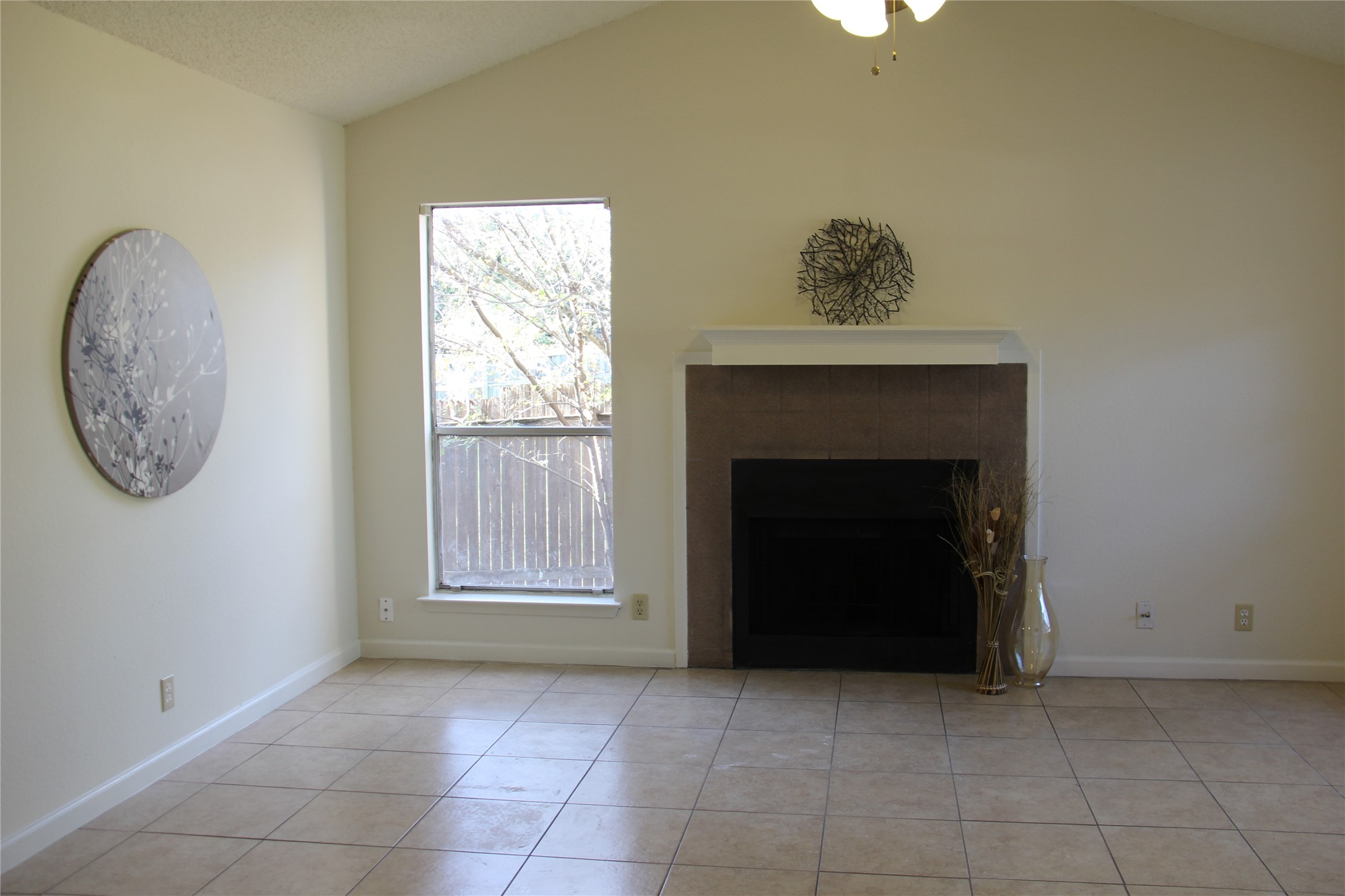 11611 Rustic Rock Drive, Unit B Austin, TX 78750 - Photo 6 of 25 a view of a livingroom with an empty space and a fireplace