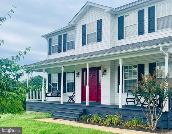 front view of brick house with a yard