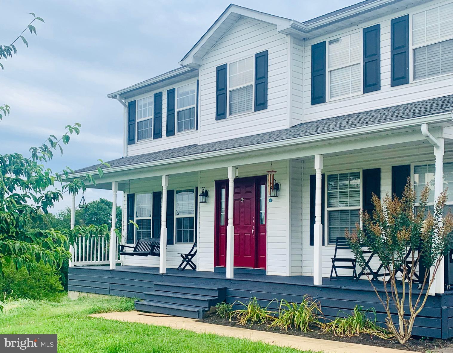 13028 Dreamers Path Culpeper, VA 22701 - Photo 1 of 13 front view of brick house with a yard