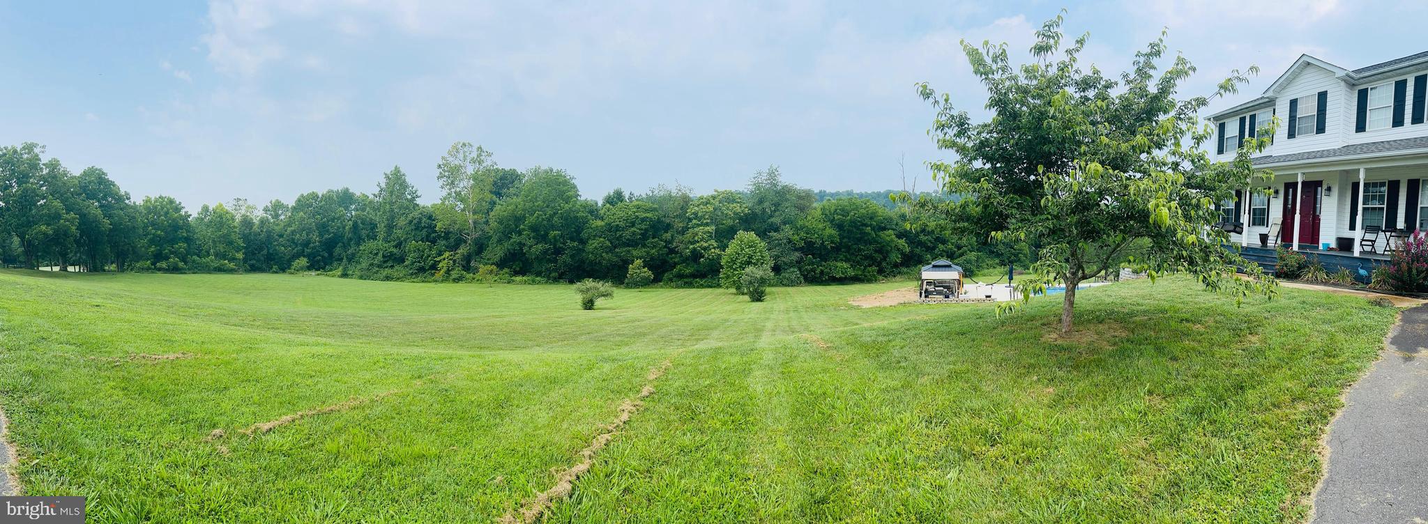 13028 Dreamers Path Culpeper, VA 22701 - Photo 2 of 13 a view of a house with a backyard