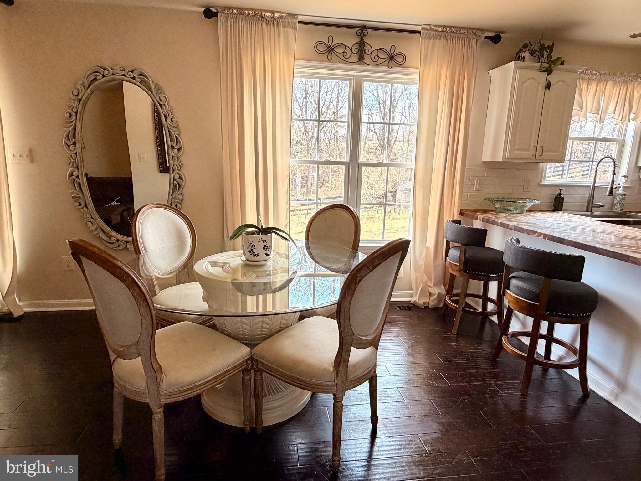 13028 Dreamers Path Culpeper, VA 22701 - Photo 6 of 13 a dining room with furniture window and wooden floor