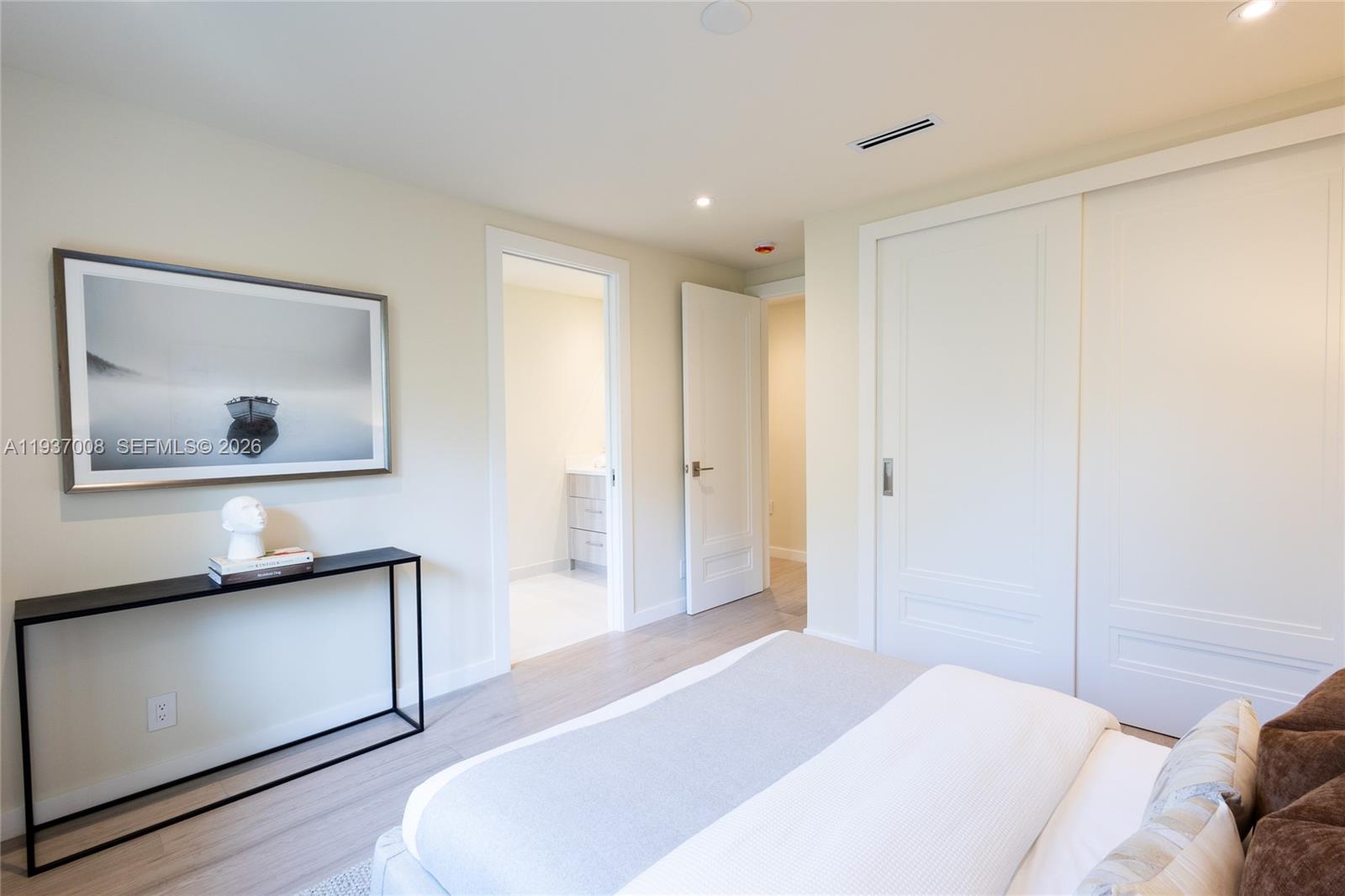 4520 Sabal Palm Road Miami, FL 33137 - Photo 8 of 22 a bedroom with a bed and a painting on the wall