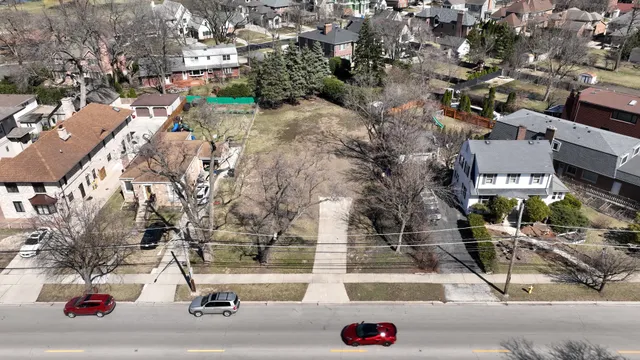 an aerial view of residential houses and street