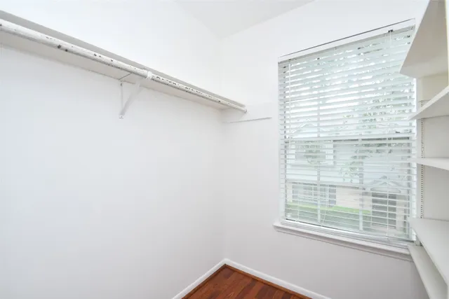 a view of entry way with wooden cabinet