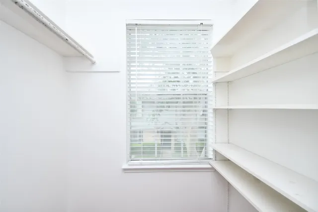 a bedroom with a large bed and a couch