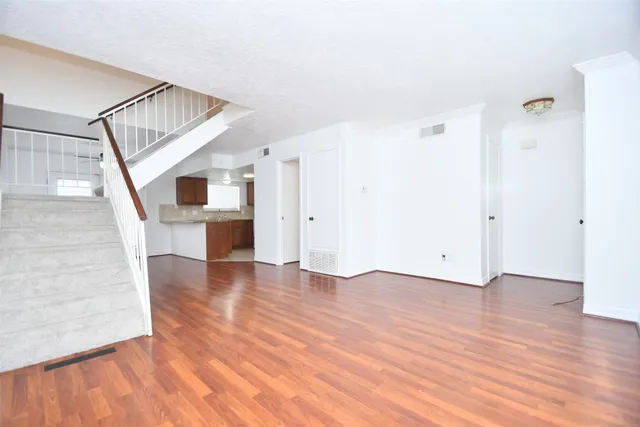 a view of entryway with wooden floor