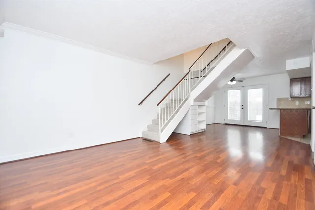 a view of a dining room with furniture and a chandelier