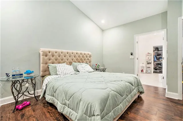 a bedroom with bed and a night stand