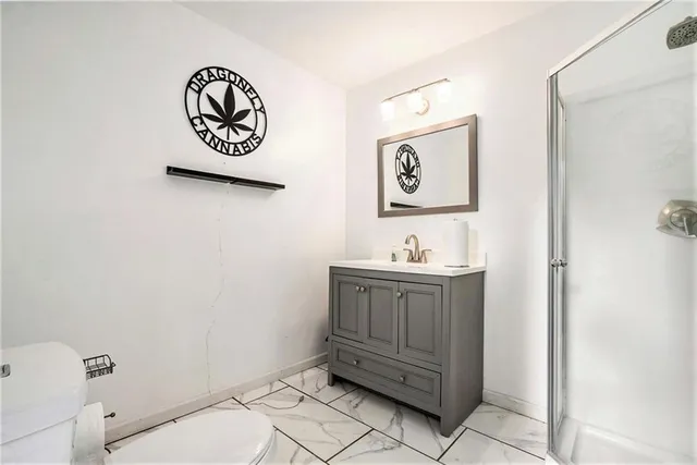 a bathroom with a toilet and a sink