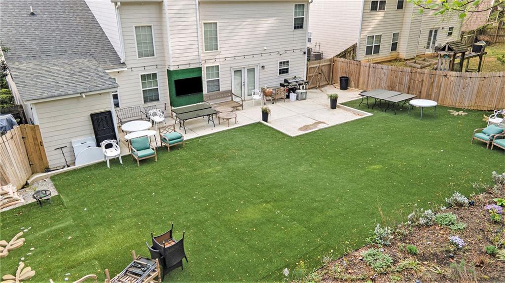 2798 Glenlocke Circle Northwest Atlanta, GA 30318 - Photo 20 of 24 a view of backyard of a house with seating space