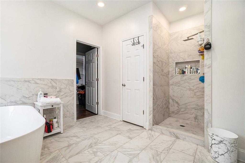 2798 Glenlocke Circle Northwest Atlanta, GA 30318 - Photo 5 of 24 a bathroom with a bathtub sink and toilet