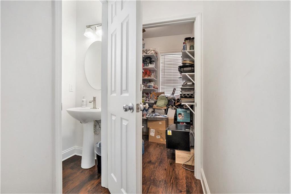 2798 Glenlocke Circle Northwest Atlanta, GA 30318 - Photo 9 of 24 a view of a livingroom with wooden floor and a bathroom view