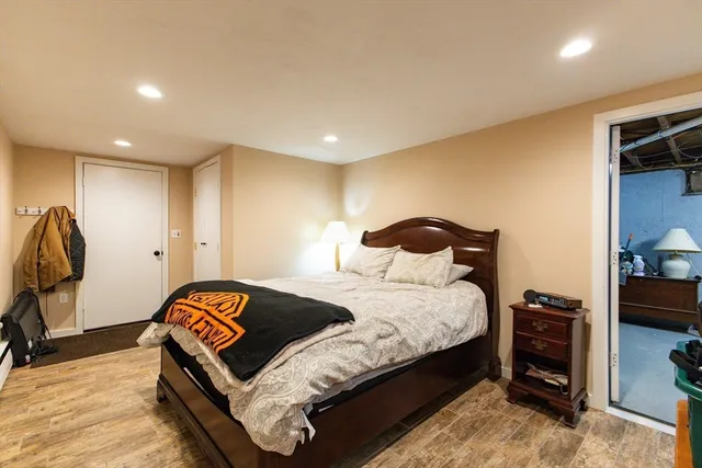 a bedroom with a bed and a tv