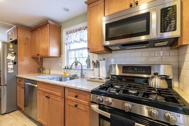 a kitchen with a stove and a microwave