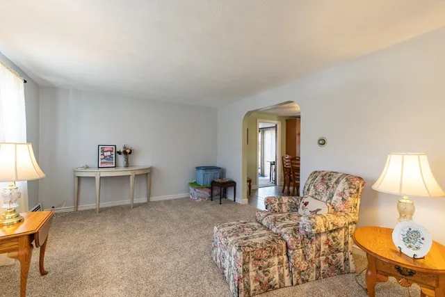 a living room with furniture and a table