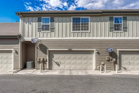 a front view of a house with a garage