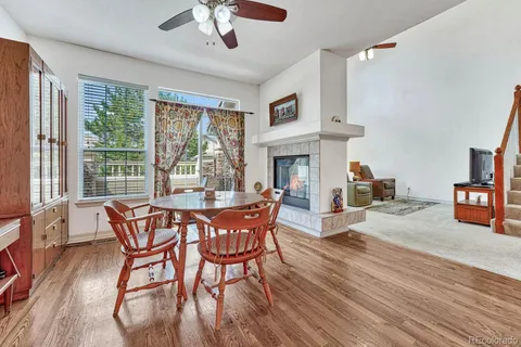 a view of a dining room with furniture window and wooden floor