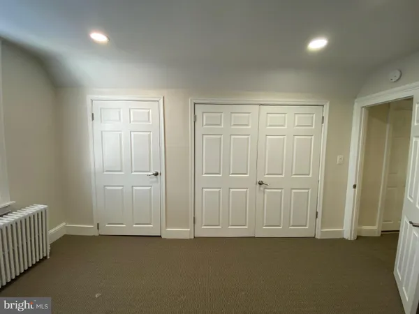 an empty room with a empty space and windows
