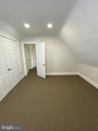 a view of a hallway with stairs