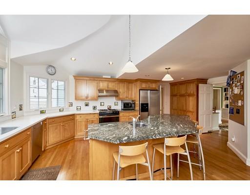 19 Alba Road Wellesley, MA 02481 - Photo 8 of 20 a kitchen with stainless steel appliances granite countertop a stove top oven a sink a dining table and chairs